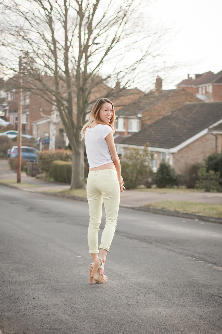 White tee and yellow pastel jeans 